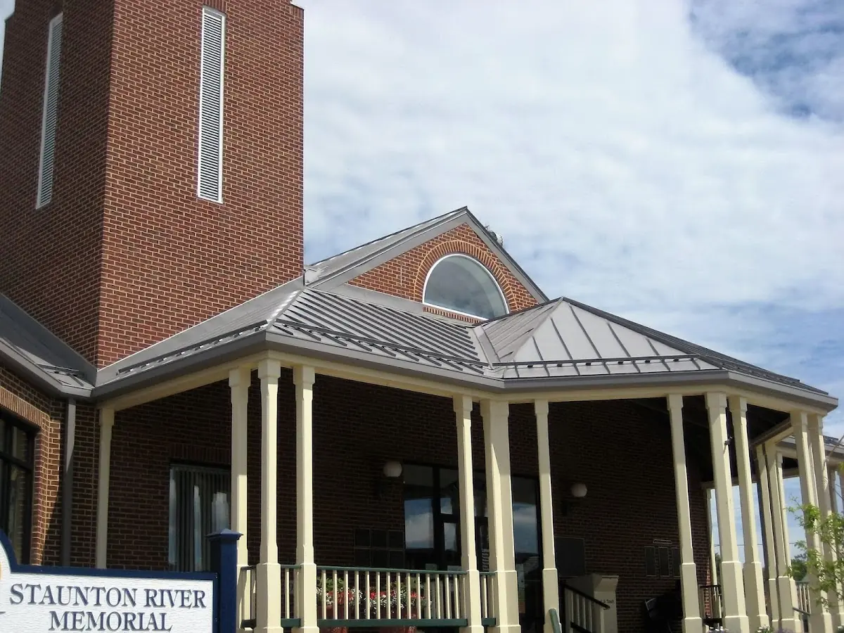 Skilled roofing craftsmen working on a residential roof in Ontario Center